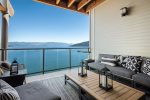 Private deck offers sweeping views.  Marina slip included.